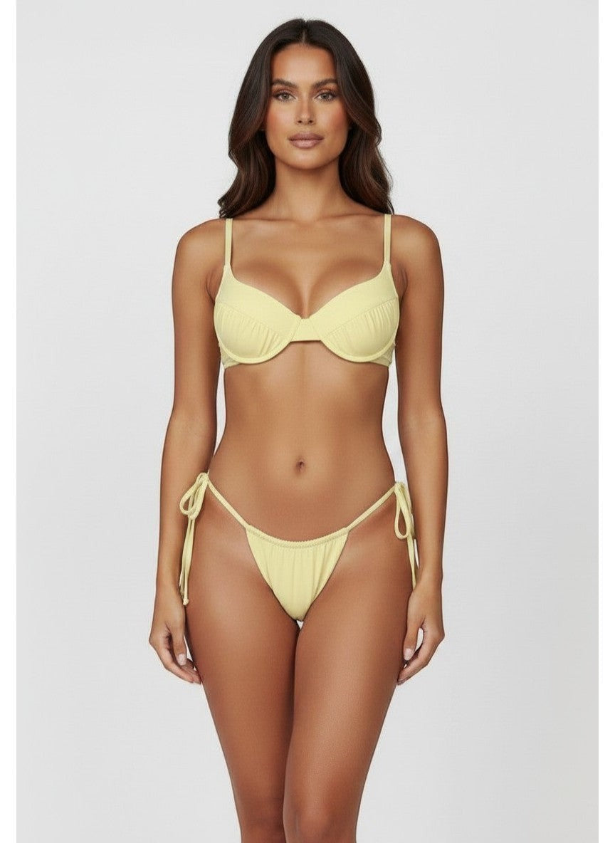 Belezini pastel yellow string bikini set with underwire top and adjustable tie-side bottoms. Stretchy fabric.