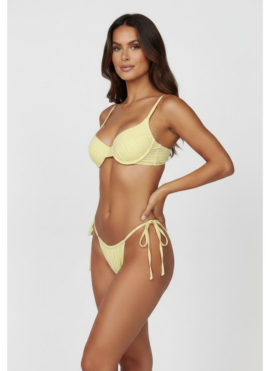 Belezini pastel yellow string bikini set with underwire top and adjustable tie-side bottoms. Stretchy fabric.